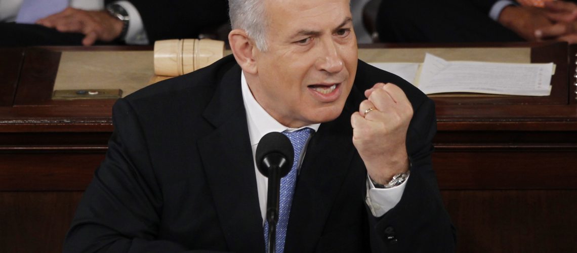 Israel's Prime Minister Benjamin Netanyahu makes a point as he addresses a joint meeting of Congress in Washington, May 24, 2011. REUTERS/Jason Reed (UNITED STATES - Tags: CRIME LAW BUSINESS ENERGY POLITICS HEADSHOT) - RTR2MU7D